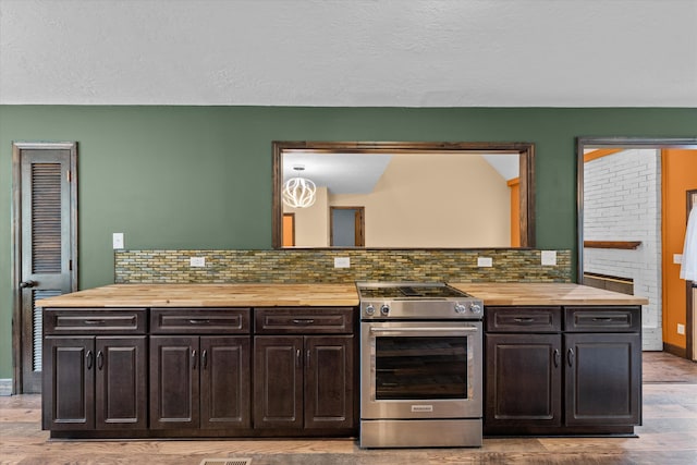 221 Creek View Cir, Martinez, GA 30907 - kitchen with butcher block counters, high end stainless steel range oven, light wood-style floors, backsplash, and a textured ceiling