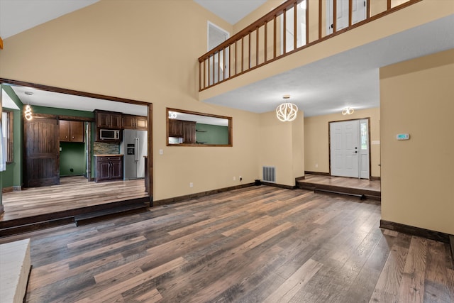221 Creek View Cir, Martinez, GA 30907 - unfurnished living room with a towering ceiling and wood finished floors