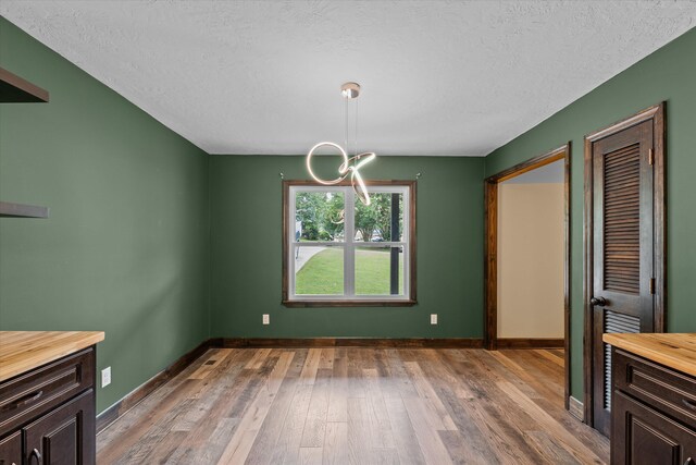 221 Creek View Cir, Martinez, GA 30907 - unfurnished dining area with light wood-style flooring and a textured ceiling