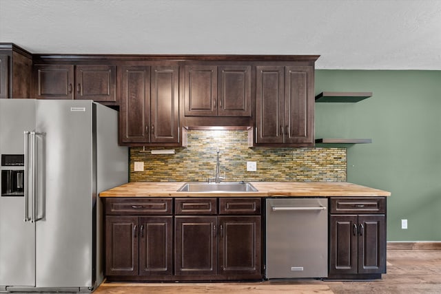 221 Creek View Cir, Martinez, GA 30907 - kitchen with stainless steel appliances, dark brown cabinetry, wooden counters, and a textured ceiling