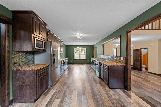 221 Creek View Cir, Martinez, GA 30907 - kitchen featuring high quality appliances, dark brown cabinets, wood finished floors, and butcher block counters