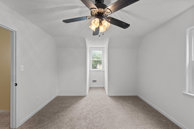 221 Creek View Cir, Martinez, GA 30907 - additional living space featuring carpet flooring, lofted ceiling, a ceiling fan, and a textured ceiling