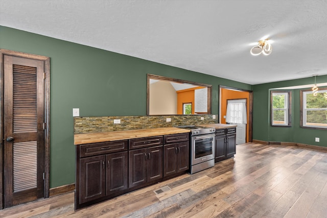 221 Creek View Cir, Martinez, GA 30907 - kitchen with stainless steel electric range, butcher block counters, tasteful backsplash, light wood-type flooring, and a textured ceiling