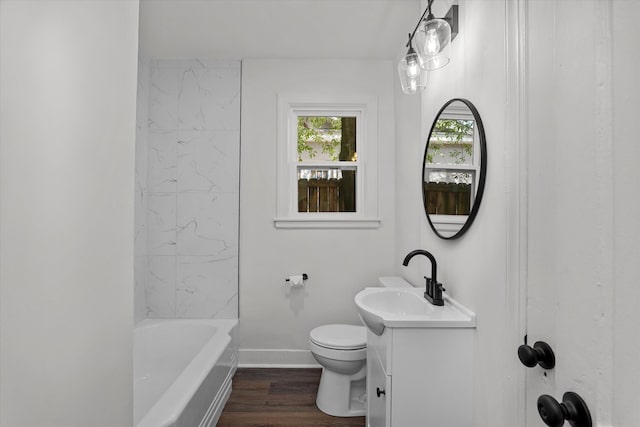 full bath featuring toilet, wood finished floors, vanity, and baseboards