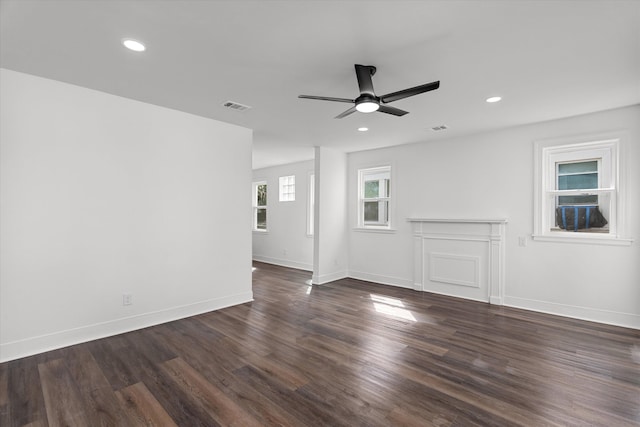 unfurnished room with dark wood-style floors, recessed lighting, and baseboards