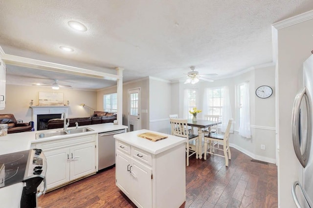 203 Longstreet Xing, North Augusta, SC 29860 - kitchen with appliances with stainless steel finishes, ceiling fan, open floor plan, a textured ceiling, and healthy amount of natural light