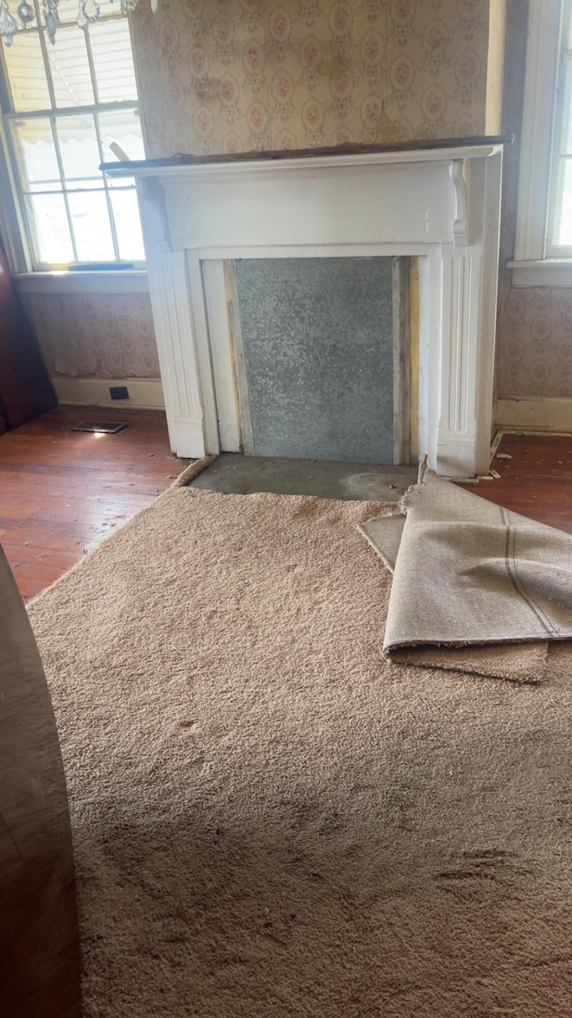 627 Montgomery St, Augusta, GA 30904 - details with baseboards, wallpapered walls, and wood finished floors