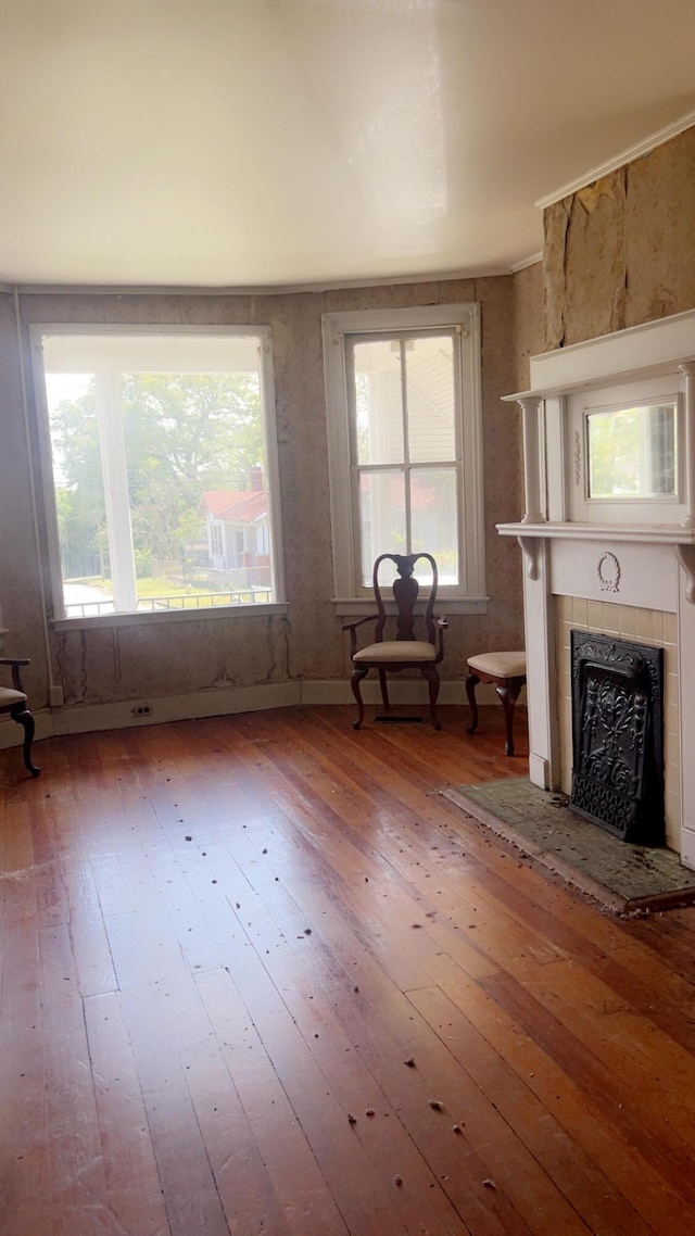 627 Montgomery St, Augusta, GA 30904 - unfurnished living room with wood-type flooring and a tile fireplace
