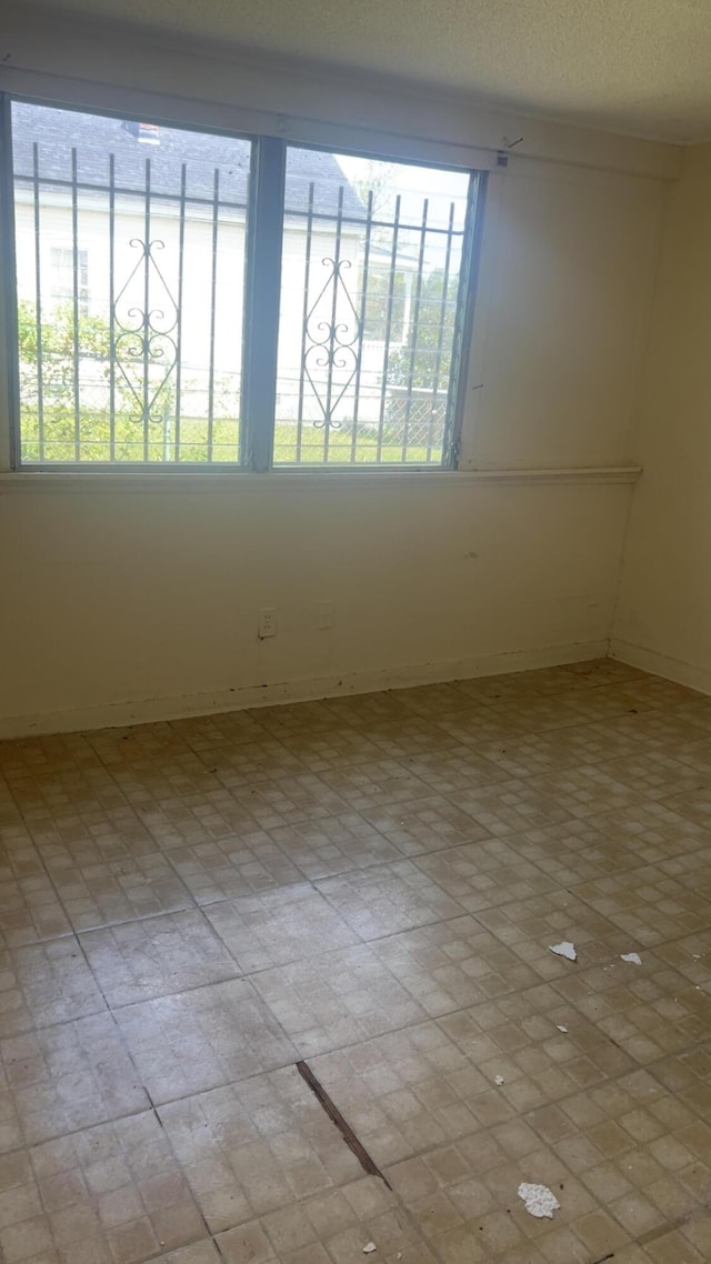627 Montgomery St, Augusta, GA 30904 - unfurnished room with brick patterned floor and baseboards