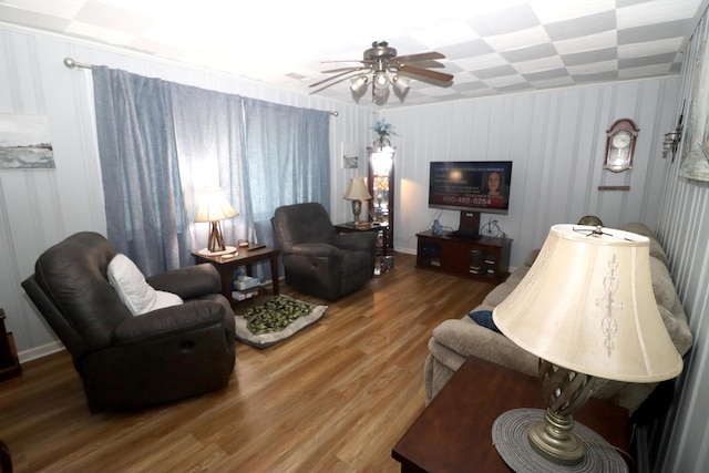 living room featuring ceiling fan and wood-type flooring