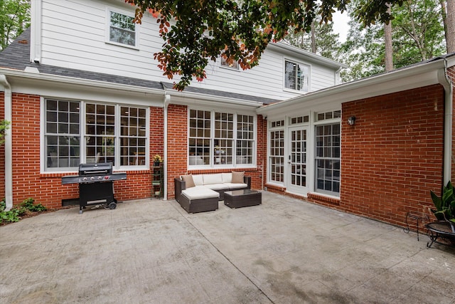 view of patio with area for grilling and outdoor lounge area