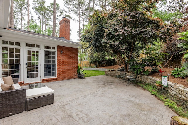 view of patio / terrace featuring fence