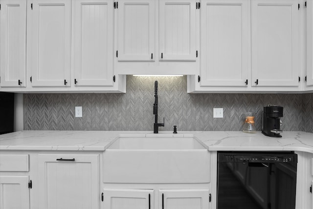 kitchen with white cabinetry, decorative backsplash, a sink, and dishwasher