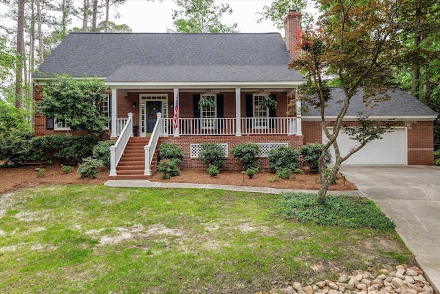 view of front of home with covered porch, brick siding, driveway, and a chimney