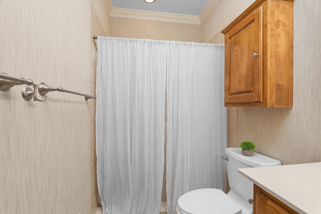 bathroom with crown molding, vanity, toilet, and curtained shower
