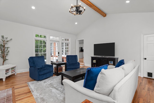 living area featuring wood finished floors, beamed ceiling, baseboards, recessed lighting, and a chandelier