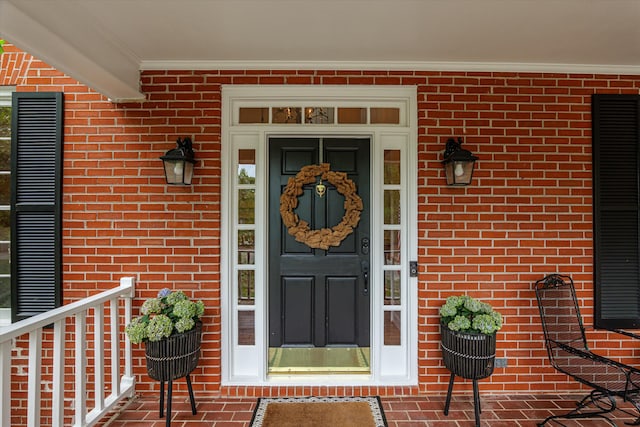 property entrance with brick siding