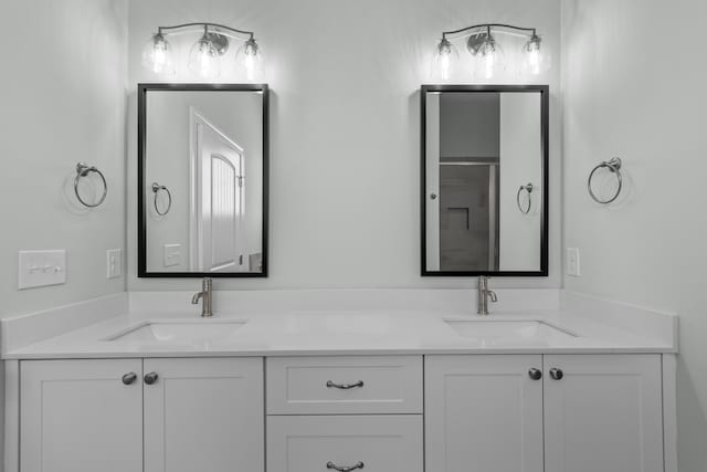 bathroom featuring a shower and vanity