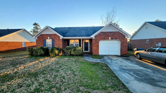 single story home featuring a front lawn and a garage