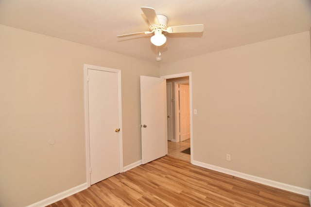 unfurnished bedroom featuring light hardwood / wood-style flooring and ceiling fan