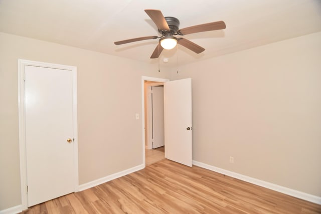 unfurnished bedroom with ceiling fan and light hardwood / wood-style flooring