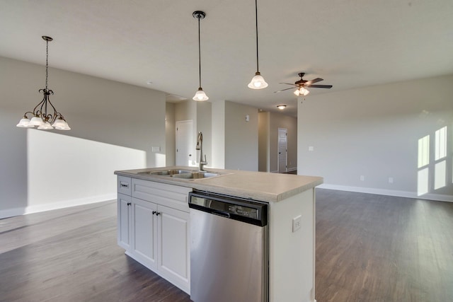 kitchen with a kitchen island with sink, a sink, open floor plan, dishwasher, and dark wood finished floors