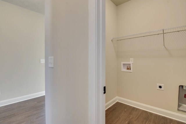 laundry room with dark wood-style flooring, hookup for a washing machine, baseboards, laundry area, and hookup for an electric dryer