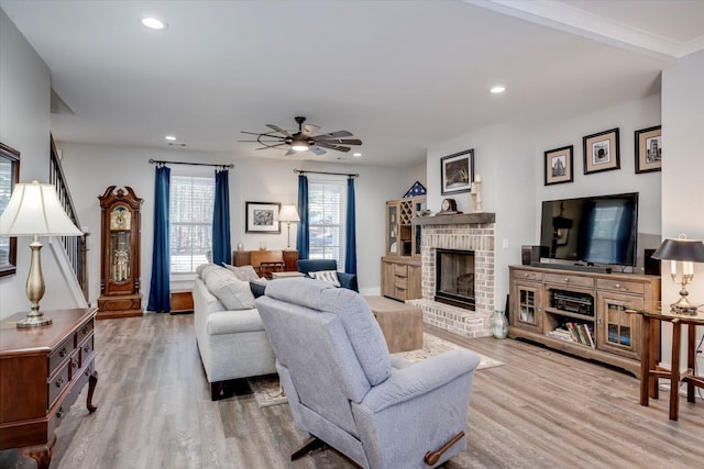 147 Shenandoah Dr, Mccormick, SC 29835 - living room featuring a brick fireplace, hardwood / wood-style flooring, and ceiling fan