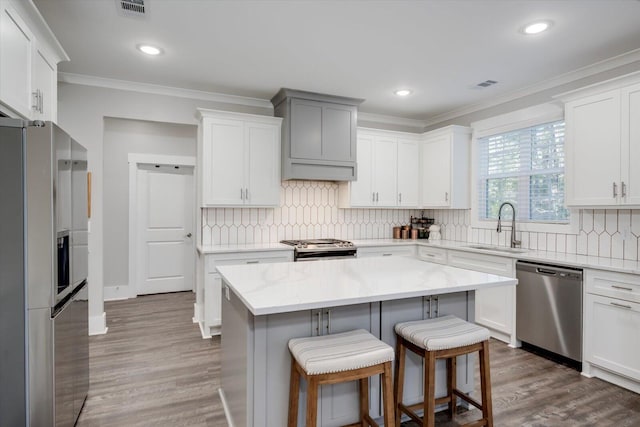 147 Shenandoah Dr, Mccormick, SC 29835 - kitchen with sink, stainless steel appliances, a center island, and white cabinets
