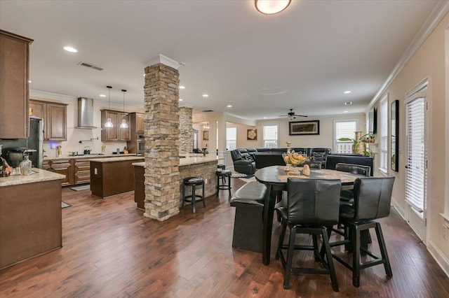 825 Burch Creek Dr, Grovetown, GA 30813 - dining area featuring decorative columns, crown molding, dark wood-style floors, a ceiling fan, and recessed lighting