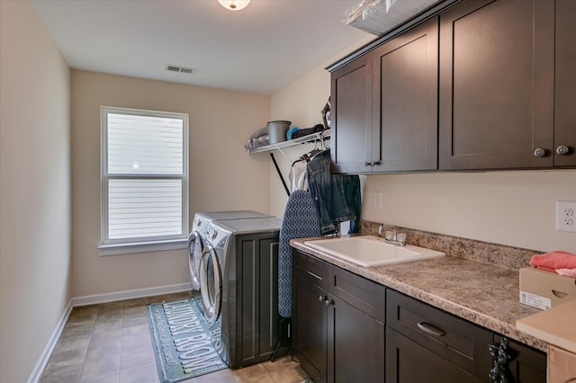 825 Burch Creek Dr, Grovetown, GA 30813 - washroom with washing machine and dryer, cabinet space, plenty of natural light, and light tile patterned floors