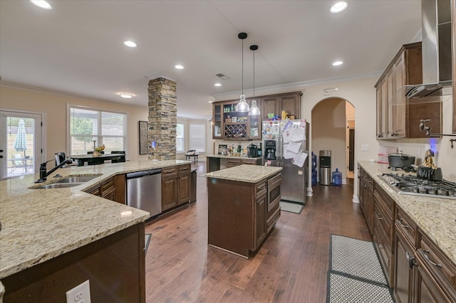 825 Burch Creek Dr, Grovetown, GA 30813 - kitchen featuring wall chimney range hood, appliances with stainless steel finishes, a large island, crown molding, and arched walkways