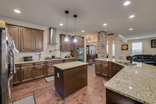 825 Burch Creek Dr, Grovetown, GA 30813 - kitchen featuring wall chimney exhaust hood, ornate columns, appliances with stainless steel finishes, crown molding, and a kitchen island
