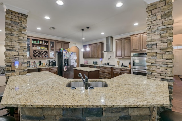 825 Burch Creek Dr, Grovetown, GA 30813 - kitchen featuring wall chimney exhaust hood, a spacious island, stainless steel appliances, crown molding, and dark wood-type flooring