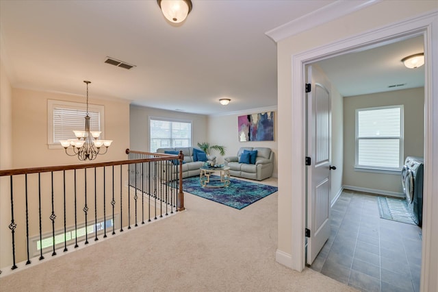 825 Burch Creek Dr, Grovetown, GA 30813 - hallway featuring independent washer and dryer, a chandelier, carpet flooring, crown molding, and an upstairs landing