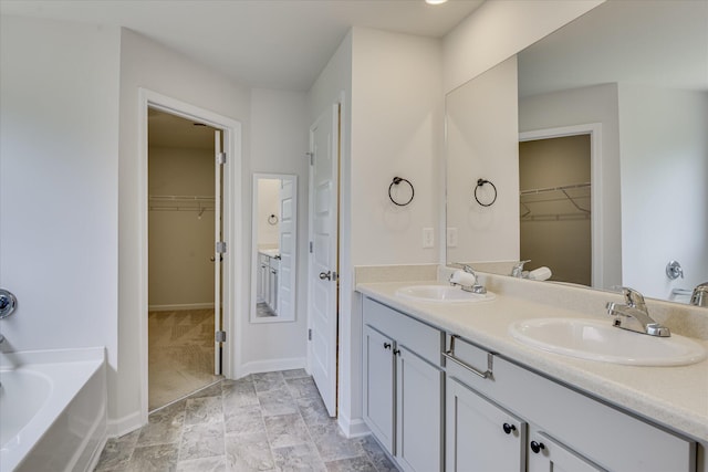 830 Otto Run, North Augusta, SC 29860 - full bathroom featuring double vanity, a spacious closet, and a garden tub