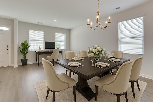 830 Otto Run, North Augusta, SC 29860 - dining space featuring a chandelier, light wood-style floors, and baseboards