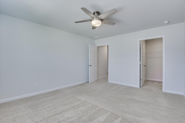 830 Otto Run, North Augusta, SC 29860 - unfurnished bedroom featuring baseboards, light colored carpet, a ceiling fan, a spacious closet, and a closet