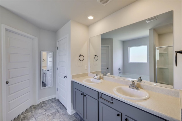 full bathroom with a stall shower, visible vents, and a sink