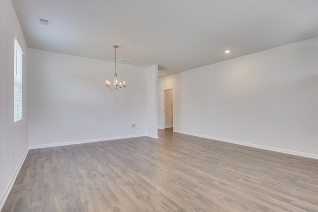 830 Otto Run, North Augusta, SC 29860 - unfurnished room featuring a chandelier, wood finished floors, baseboards, and recessed lighting