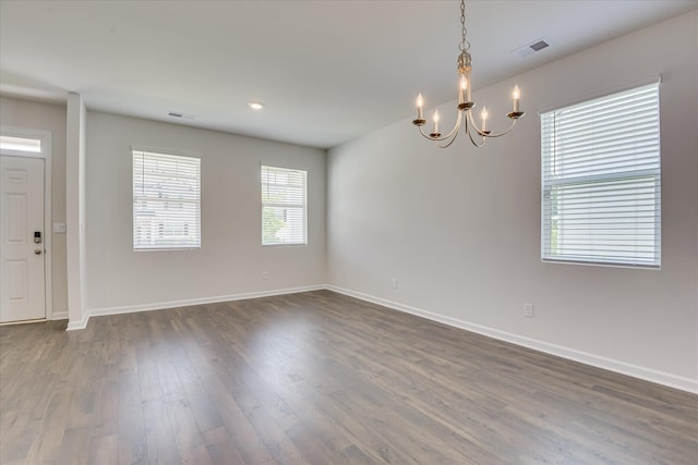830 Otto Run, North Augusta, SC 29860 - spare room featuring a chandelier, dark wood finished floors, and baseboards