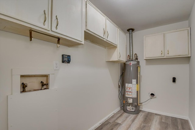 clothes washing area with cabinets, washer hookup, electric dryer hookup, water heater, and light hardwood / wood-style flooring