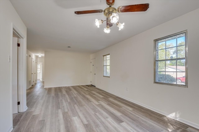 spare room featuring ceiling fan and light hardwood / wood-style floors