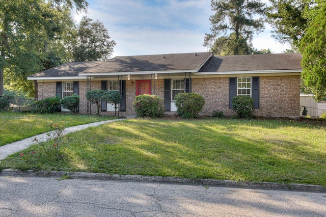 ranch-style house with a front lawn