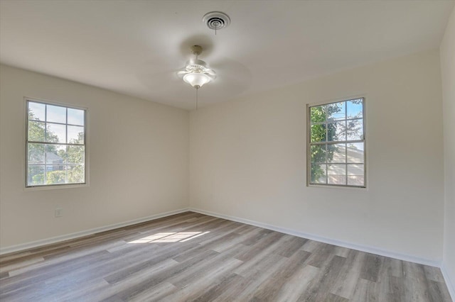 spare room featuring ceiling fan and light wood-type flooring