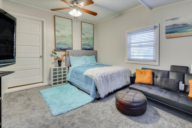 carpeted bedroom with ceiling fan and crown molding