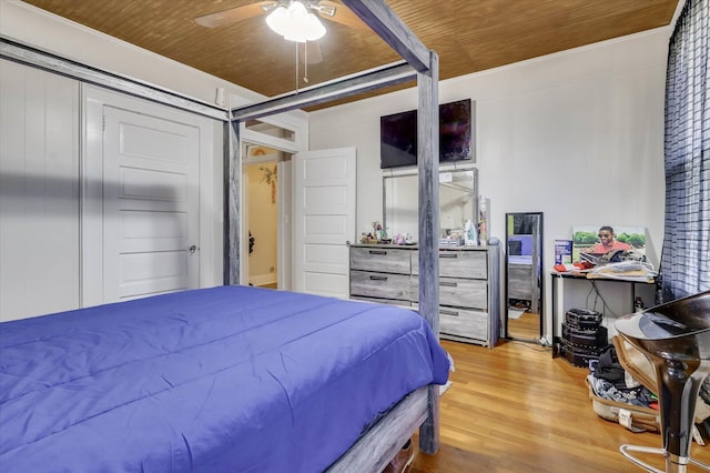 bedroom with ceiling fan, hardwood / wood-style floors, and wood ceiling