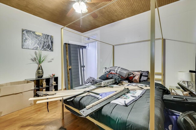 bedroom with wood-type flooring, ceiling fan, and wood ceiling