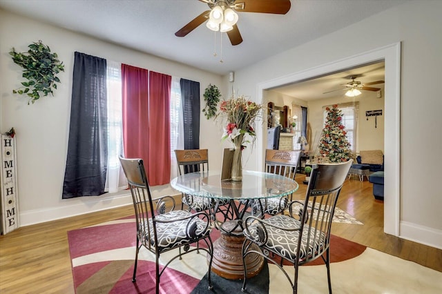 dining space featuring hardwood / wood-style floors, plenty of natural light, and ceiling fan