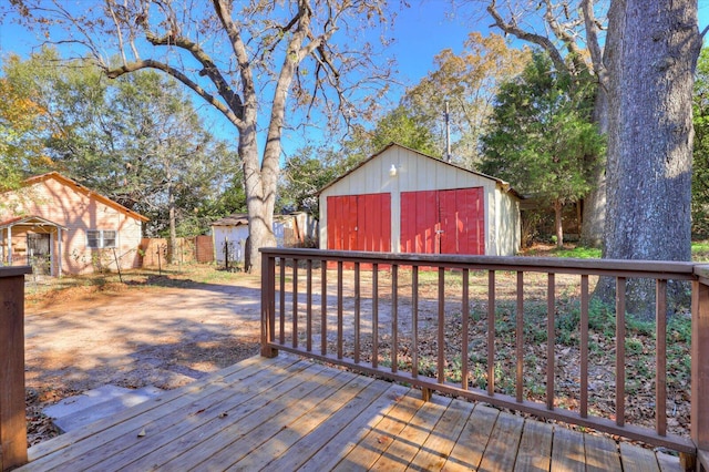 wooden terrace with a storage shed